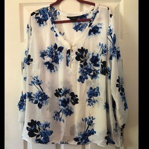 Blue and white floral top with gold zipper detail